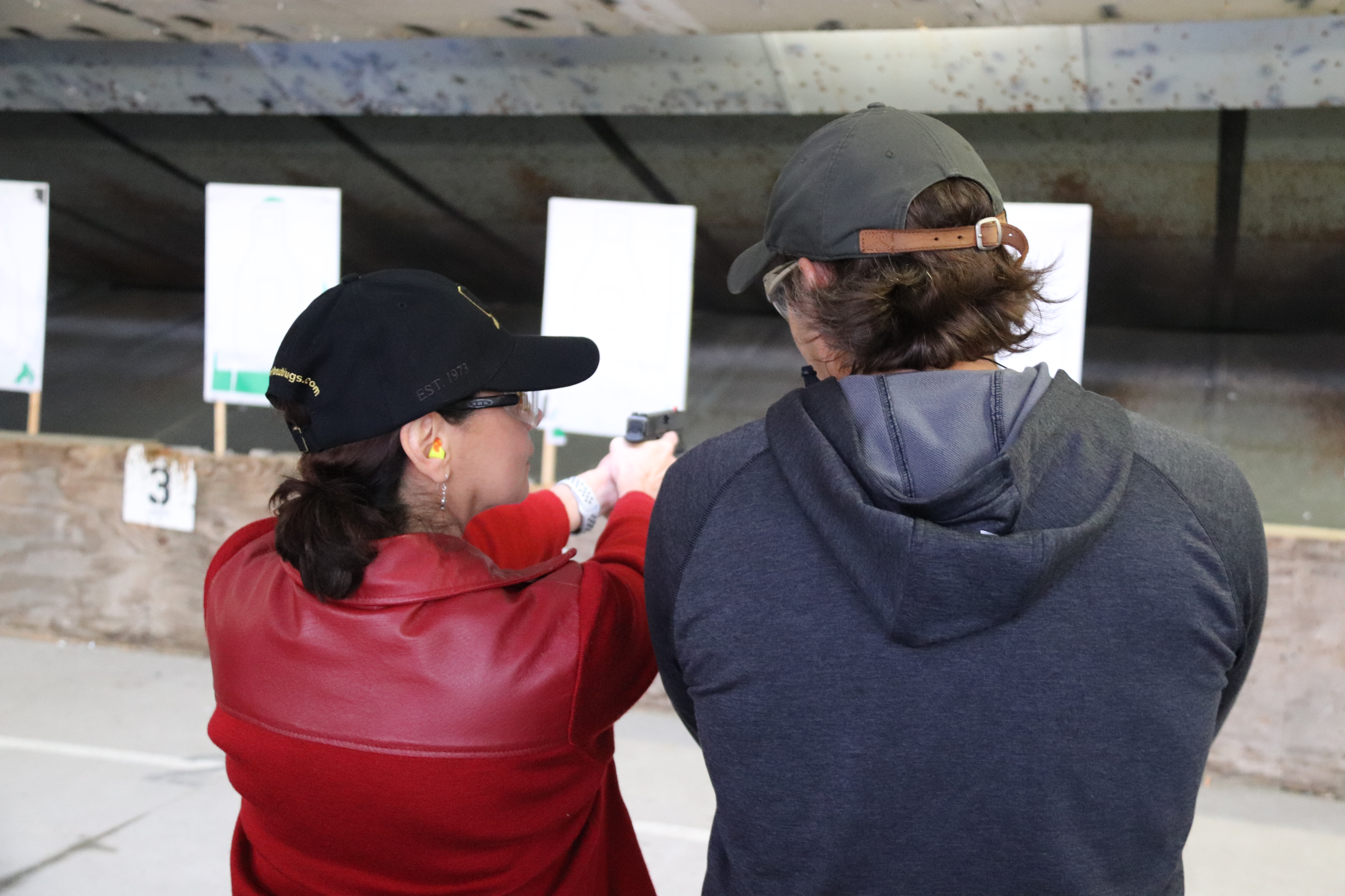 A DEA Special Agent gives instructions to a Citizen Academy student in 2018