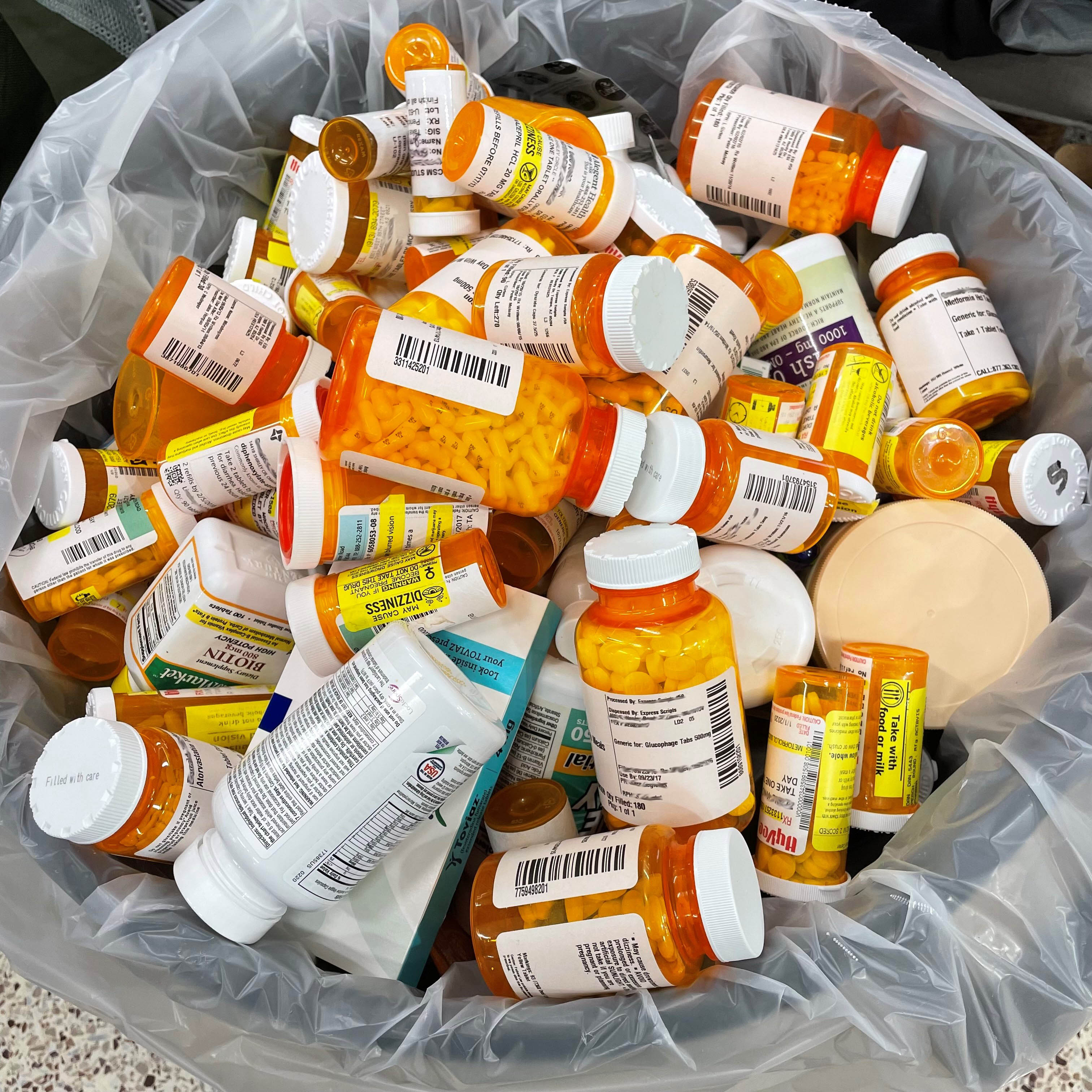 Prescription medications in a trash bag.