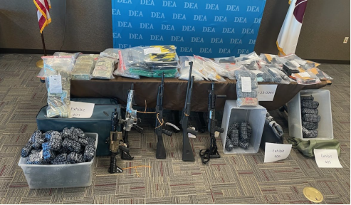 Photo of guns and drugs seized by DEA on October 23, 2024