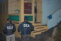 DEA Agents provide perimeter security a one of the arrest locations