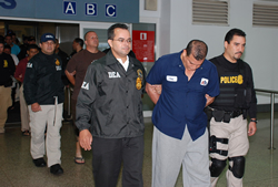 DEA Agents escort Manuel SANTIAGO-Alvarado, Control Crew Chief 