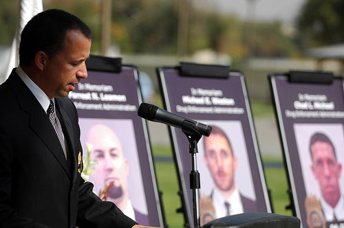 DEA Assistant Regional Director Jay Fitzpatrick honors his fallen colleagues at a ceremony at the U.S. Embassy in Kabul Afghanistan. (Photo by Daniel Wilkinson)