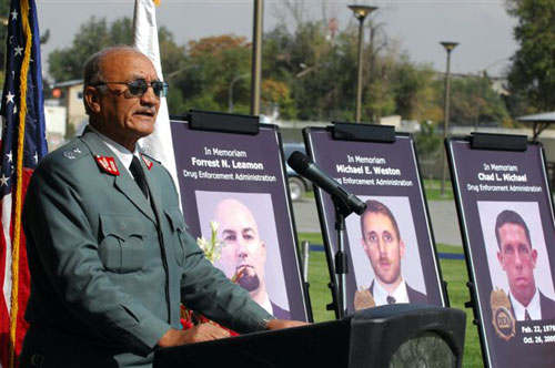 "Acting Deputy Minister of Counter Narcotics General Afizullah Rahju pays tribute to the 3 fallen DEA agents killed in Afghanistan Oct 26, 2009." Photographer: Daniel Wilkinson 