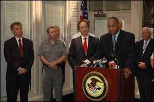 Associate Special-Agent-in-Charge Wilbert L. Plummer of the Drug Enforcement Administration’s (DEA) New York Field Division (NYFD) addresses the media today with U.S. Attorney William J. Hochul, Jr. upon announcing that 33 people have been arrested and charged with unlawfully trafficking in prescription pills in a series of indictments and criminal complaints unsealed today in federal court.  