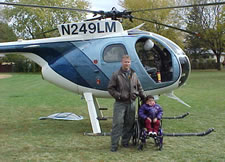 Pilot and Student in front of helicopter