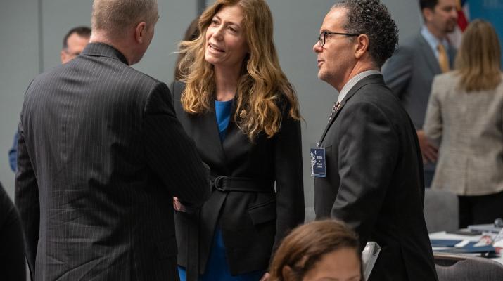 Mrs. Milgram and Jon DeLena meeting with family member