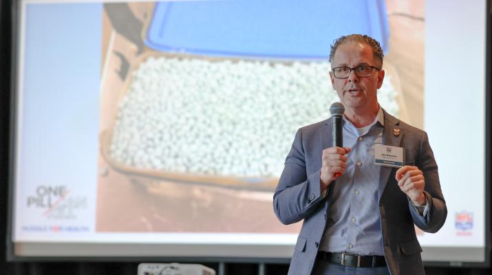 Jon DeLena speaking at the NFL Alumni Health Symposium