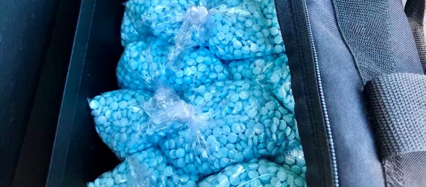 Thousands of fentanyl pills transported in duffle bag.