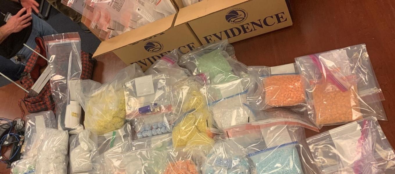 A photograph of the narcotics and some of the other material recovered from the Apartment