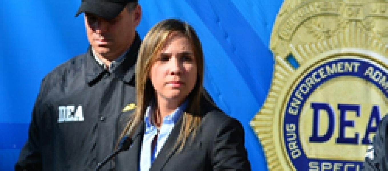 Assistant U.S. Attorney Teresa Zapata (R) and Special Agent Eddie Rosado (L), announce to the news media the indictment of 63 members of the drug trafficking organization lead by brothers Edwin and Edward Santiago during a news conference.