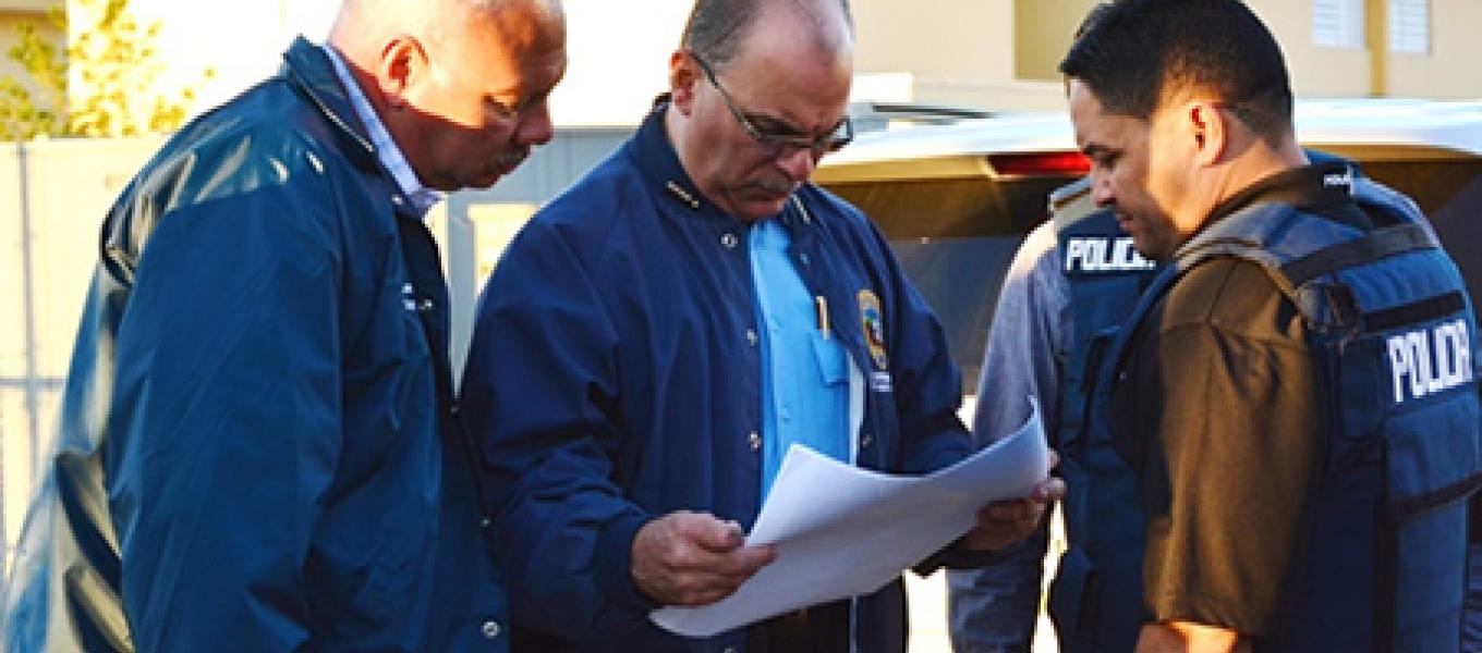 DEA Special Agent provides perimeter security during arrest operation at La Ceiba Public Housing Project in Ponce, Puerto Rico