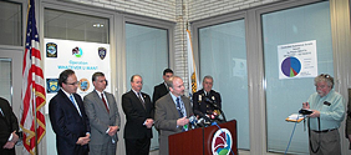 RAC Dale Kasprzyk at the podium. L-R (background): U.S. Attorney William J. Hochul, Jr., Gary Baldauf Regional Director Medicaid Fraud, ASAC James R. Burns Jr., Niagara County Sherriff James R. Votour, Niagara Falls Chief of Police John R. Chella.