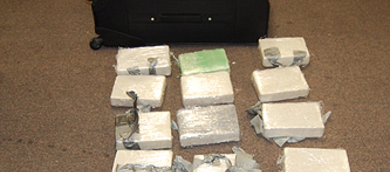 24 kilograms of cocaine seized by DEA and ICE at PHL concealed in two separate suitcases.