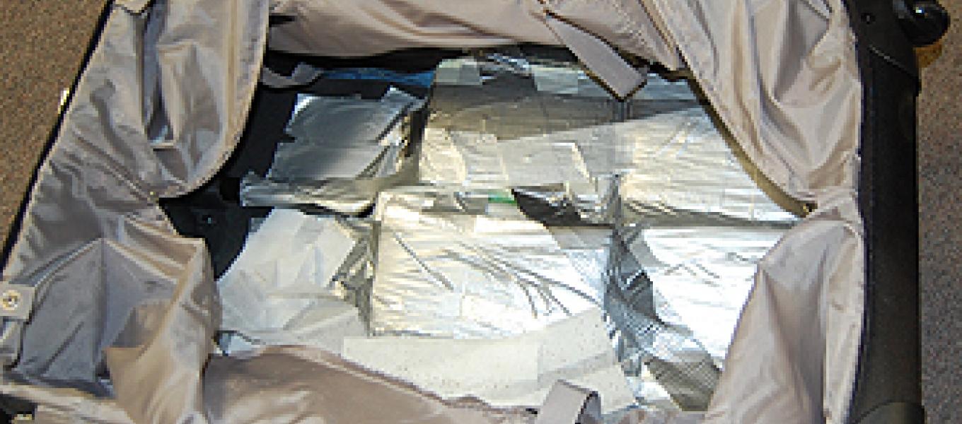 24 kilograms of cocaine seized by DEA and ICE at PHL concealed in two separate suitcases.