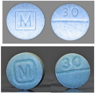 blue counterfeit and real pills