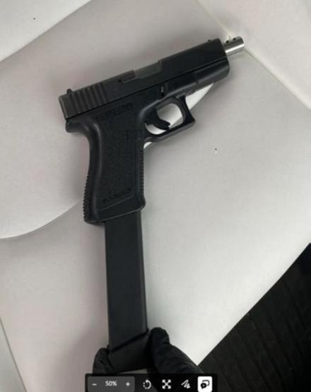 Gun with extended magazine seized.